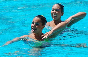 Taylor Durand, left, and Debbie Chen from Stanford perform in the pairs competition during the National Synchronized Swimming. Championships at the Student Recreation Center on Saturday. 