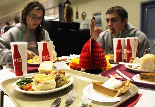 Amanda Genung, pre-physiology sophomore, left, and Joshua Connors, pre-education sophomore, right, have Thanksgiving dinner with friends at Park Student Union Monday, Nov. 11th. Park Avenue Market host a themed dinner the Monday before Thanksgiving with roasted turkey, stuffing, cranberry sauce, mashed potatoes, choice of vegetables, rolls, choice of pie.
