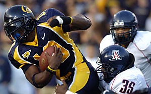California running back Marshawn Lynch is pulled down by departed Arizona defensive lineman Sean Jones during the second half of Arizonas 28-0 loss against then-No. 12 California in October 2005 at Memorial Stadium in Berkeley, Calif. Lynch rushed for 107 yards on 20 carries in that game, and may give the Arizona defense trouble Saturday at Arizona Stadium. 