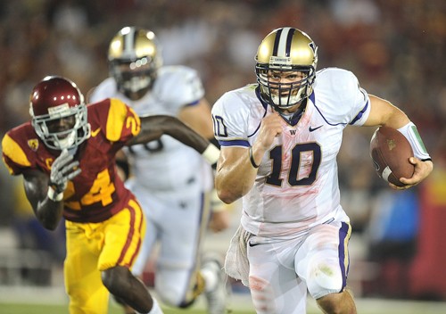Washington quarterback Jake Locker (10) breaks away from USC cornerback Shareece Wright to pick up yards in the thirrd quarter at the Coliseum in Los Angeles, California, on Saturday, October 2, 2010. Washington defeated the Trojans, 32-31. (Wally Skalij/Los Angeles Times/MCT)