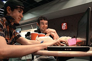 Undeclared freshmen Josh and Lee Klein surf the net wirelessly Monday afternoon in the Student Union Memorial Center food court. The student union will soon feature one of many new wireless access points soon to open on campus.