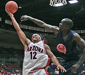 Guard Daniel Dillon drives to the hoop in Arizonas 125-74 win over Team Georgia Saturday in McKale Center. Dillon scored 15 points, including three 3s, and collected five assists.