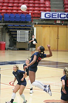 UA freshman Whitney Dosty rises for a kill in practice yesterday in McKale Center. The outside hitter and No. 4 recruit in the nation is expected to make up for some of the lost production from departed All-American outside hitters Kim Glass and Jennifer Abernathy.
