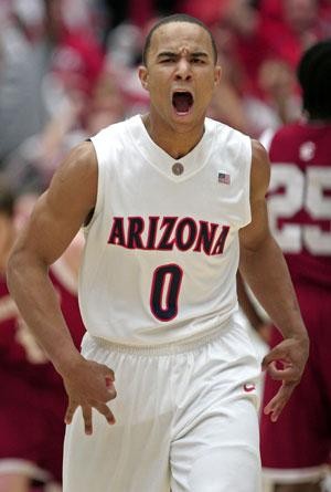 UA guard Jerryd Bayless celebrates hitting a 3-pointer during Arizonas 76-64 win over No. 6 Washington State last night in McKale Center. The Wildcats were in a joyous mood all evening in part because of Bayless team-high 23 points and six assists.