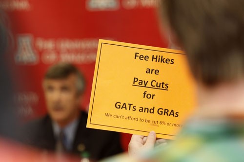 Timothy Galaz / Arizona Daily Wildcat

A member of the audience holds up a sign protesting increases of student fees while President Robert Shelton proposes the highest monetary increase in tuition the University has ever had.
