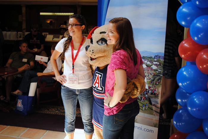 Wilma Wildcat poses with two incoming freshmen at the 2011 UA Phoenix Summer Send-Off. More than 1,400 incoming freshmen attended the event along with their families. 