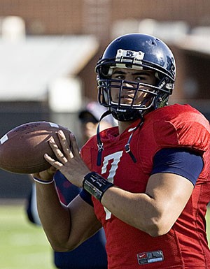 Arizona quarterback Willie Tuitama rocks back to pass in a March 24 practice at Jimenez Field. Tuitama and the Wildcats look to improve on their offense in tomorrows Spring Game.