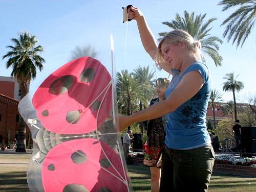 Krista Kinnard, a sophomore majoring in molecular and cellular biology, flies her ladybug-patterned kite yesterday afternoon on the UA Mall.