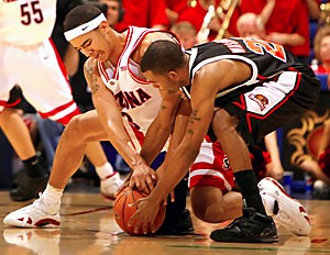 Arizona freshman forward Marcus Williams fights for a loose ball during the Wildcats 80-58 win over Oregon State Saturday. While Williams had a nice game of 16 points and five rebounds, Arizona was keyed by the play of Ivan Radenovic, who scored a career-high 26 points against the Beavers.