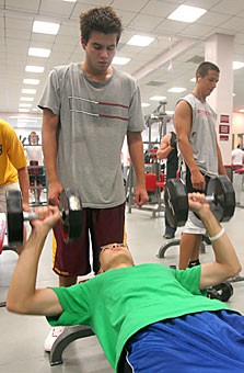 Pre-physiology freshmen Razvan Marc and Jason Nguyen lift together in the Rec Center weight room yesterday. The Rec Center will be building a new weight room, two basketball courts, and a climbing wall, to be finished spring 2009.