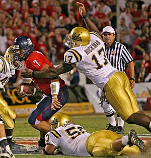 UCLA defensive end Justin Hickman rushes UA quarterback Willie Tuitama in Arizonas 52-14 win over the then-No. 7 Bruins last November at Arizona Stadium. Hickman, UCLAs only senior defensive starter, ranks second in the Pacific 10 Conference with 5.5 sacks.