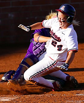 Arizonas Laine Roth slides into home in the super regionals against Louisiana State at Hillenbrand Stadium in May. The softball team slid into its seventh national championship this summer, its first since 2001. 