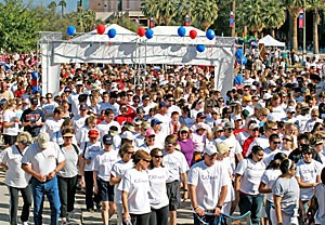 Participants march through the starting line during the CATwalk on the UA Mall yesterday. Members of several fraternities, sororities and UA sports teams participated in the event, which raised $82,000 to benefit the Arizona Cancer Center.