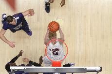 UA forward Chase Budinger leaps for a dunk during the Wildcats 106-97 win against No. 23 Washington Thursday night in McKale Center. Budinger recorded 25 points and 8 rebounds in 39 minutes of play.