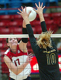 Oregon outside hitter Heather Meyers denies an attack from Arizona opposite hitter Randy Goodenough in the Ducks sweep over the Wildcats in McKale Center on Sept. 28. The two left-handers lead their respective teams on the attack.