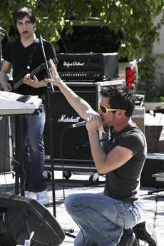 Brandon Turner, lead singer of the band AV, rocks out to a crowd as part of the Rock for Hunger fundraiser outside the Park Student Union on Saturday afternoon.