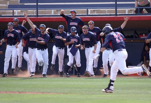 The Arizona bench explodes in celebration after senior Rafael Valenzuela knocked in the game-winning run during a comeback victory against Washington State at Sancet Stadium on Sunday. The 12-11 victory capped off the Wildcats? first Pac-10 sweep of the season. 