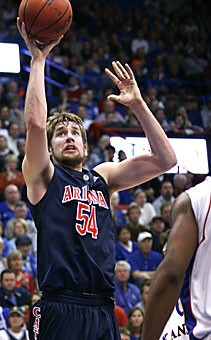 UA center Kirk Walters goes up for his only field goal attempt in Arizonas 76-72 overtime loss to No. 4 Kansas in Allen Fieldhouse on Sunday night. The 6-foot-10 Walters played 19 minutes in his second appearance of the season.
