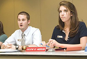 Sen. Dustin Cox, left, and Executive Vice President Jessica Anderson sit in during the ASUA Senate meeting in the Student Union Memorial Center last night. 