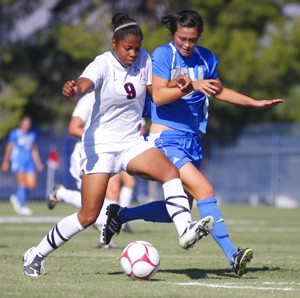 Arizona soccer forward London King dribbles past a UCLA defender Sunday in a 2-0 loss at Murphey Field. The Wildcats lost to both No. 3 UCLA and No. 7 USC over the weekend but have maintained a greater offensive production this season compared with 2007.