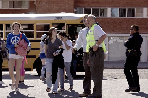 Tim Glass / Arizona Daily Wildcat

Brian Seastone, UAPD commander of emergency management services, coordinates the evacuation of close to 800 Tucson High students to Bear Down Gym after a bomb threat was called into the school yesterday.