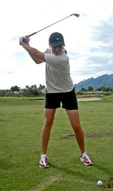 Arizona junior golfer Alison Walshe has her eye on the ball as she gets ready to swing during practice at Oro Valley Country Club in September. Walshe is sad that Greg Allen wont be her head coach anymore, but is staying upbeat about the transition.