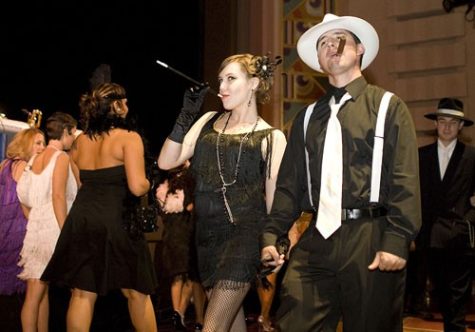 Second-year architecture student Marie Taylor, left, and fifth-year architecture student Bubba McKinney, strut their stuff during the Beaux Arts Ball Saturday night at the Fox Theatre. The '20s themed ball is an annual fundraising event put on by the College of Architecture and Landscape Architecture.