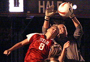 Arizona goalkeeper Devon Wharf rises in an attempt to reach the ball during the Wildcats 2-1 loss to Utah on Friday night. Wharf is the third goalie to sustain an injury this season.
