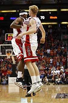 Forward Chase Budinger, right, and guard Jawann McClellan celebrate after Budinger converted a layup while being intentionally fouled in the second half of Arizonas 84-72 win over Illinois in the Hall of Fame Challenge Saturday in Phoenix. Budinger was awarded game MVP honors after leading Arizona in scoring with 22 points and rebounding with eight boards.