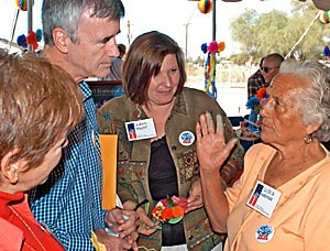 Tucson Councilwoman Nina Trasoff, left, President Robert Shelton and Flandrau Science Center Executive Director Alexis Faust speak about the Rio Nuevo project with Gloria Moroyoqui, a Yaqui medicine woman and the designer of the paper flower decorations at the UA Rio Nuevo Event yesterday morning. The event featured representatives from several of the organizations involved speaking about their plans for the downtown Tucson project.