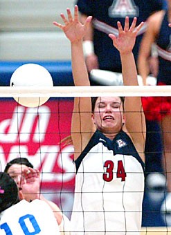 Arizona setter Paige Weber jumps up for a block in a sweep over Cal-State Bakersfield last Friday in 