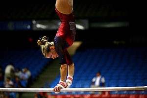 UA gymnast Sarah Specht performs on the bars during a March 21 win over Brigham Young and Cal State-Fullerton in McKale Center. Specht and the Gymcats had an up-and-down season which was highlighted by their fourth-place finish at the Pacific 10 Conference Championships in Seattle.