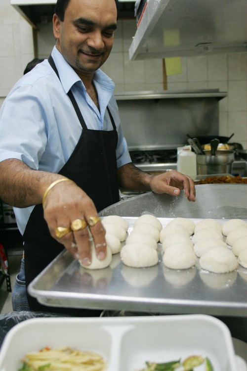 Ashlee Salamon / Arizona Daily Wildcat
Raj Singh, a cook at Shere Punjab Indian Restaurant on the northeast corner of 1st Ave. and Grant makes bread called naan for the dinner crowd on Tuesday Nov. 24th.
