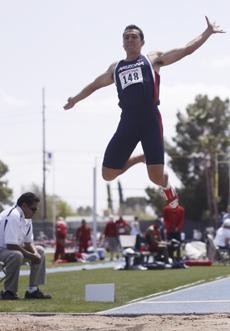 UA senior jumper Luis Rivera-Morales leaps through the air during the Jim Click Classic on April 3 at Drachman Stadium. The Wildcats track and field teams will send a small group of athletes to Tempe this weekend to compete in the Sun Devil Invitational.