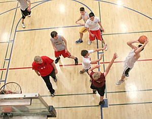 UA students play basketball yesterday afternoon inside the Student Recreation Center. The floor plan of the expanded Rec Center may be significantly altered due to rising construction prices, and an architectural firm has yet to be chosen.