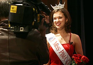 Newly crowned Miss Pima County Stephanie Brooks gives her first TV interview after the beautypeagant yesterday at Flowing Wells High School. Brooks, a UA dance senior, also was elected Miss Yuma County in 2005. 