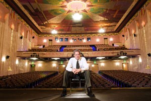 Herb Stratford, long-time executive director of the Fox Theatre Foundation, is seen here inside the legendary vaudeville theater. Stratford announced his resignation last week.