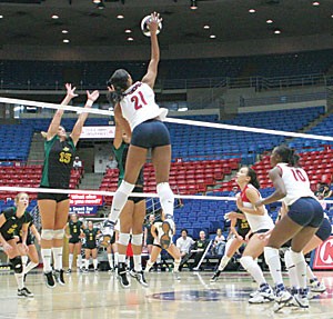 Freshman Whitney Dosty gets some serious hang time as she spikes the ball during a four-set victory over San Francisco on Saturday in McKale Center. Dosty was named to the All-Tournament Team as Arizona swept through the Four Points Sheraton Arizona Invitational this weekend.