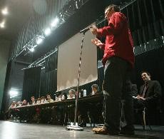 Michael Slugocki, a political science senior and member of the Arizona Students Association, speaks to a panel of democratic legislatures during a public hearing forum addressing the public concerns of proposed budget cuts. 