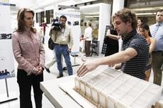 Chad Nielsen, right, an architecture senior, explains different features of the SEED [pod] solar housing project to Arizona Congresswoman Gabrielle Giffords on Friday. The SEED [pod] will be entered into The 2009 Solar Decathlon Competition held on the National Mall in Washington, D.C. later this Fall.