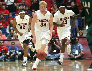 Arizona forward Chase Budinger (34) leads Jamelle Horne (42) and Jordan Hill (43) down the court in a 72-71 loss to Alabama-Birmingham in McKale Center on Tuesday. Budinger said its his job to motivate the team when they play Mississippi Valley State today in Athens, Ga.