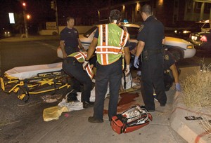 Paramedics tend to a Tucson man shot just north of the UA campus on Monday night on Speedway Boulevard. A driver noticed the man stumbling across the street and called the Tucson police.