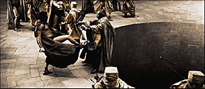 King Leonidas (Gerard Butler) gives his answer to the Persian messenger via his foot. Almost all of the effects-laden film was shot in studio with 