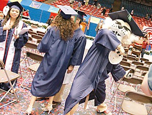 UA mascot Wilbur T. Wildcat rears back to throw a tortilla at the spring 2005 afternoon graduation ceremony. Campus administrators are still worried that tortillas could injure or offend students and their families at next weeks commencement ceremony.