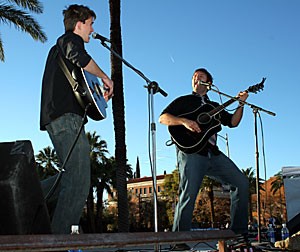 Ryanhood singers and guitarists Ryan Green, left, and Cameron Hood bust out tunes for students on the UA Mall yesterday afternoon. The concert kicked off the next two weeks of ASUA elections.