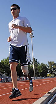 Danny Andrews, who trains with the UA track field team runs at practice at Drachman Stadium. Andrews had his leg amputated at 14, has set three Paralympic world records and is training for the 2008 Paralympics in Beijing. 