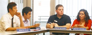 ASUA Senators, from left, Matthew Ellis, Andre Rubio, Nick Macchiaroli and Gabby Ziccarelli discuss upcoming plans during a meeting on Oct. 1.  During their meeting on Wednesday, the board discussed events for Homecoming Week as well their plans to endorse new programs promoting healthy lifestyles among students.