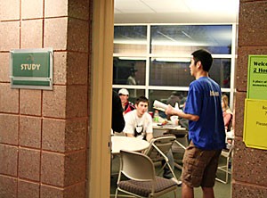 Mechanical engineering junior Kevin Do, a new resident assistant who replaced one of the five Pima RAs fired over the break, reviews the rules of residency in a Pima Hall meeting Sunday.