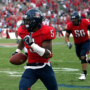 Arizona cornerback Antoine Cason heads into the end zone for his first career interception returned for a touchdown in the Wildcats 24-20 upset of No. 8 California Saturday at Arizona Stadium. Casons score gave Arizona its first lead of the contest, which the Wildcats never relinquished.