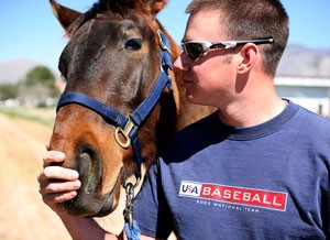 Arizona pitcher Preston Guilmet has a love for horses. Seen here with Rosebud, a filly from his horse training class, Guilmet is late to three baseball practices a week so he can spend time learning about his unique hobby.